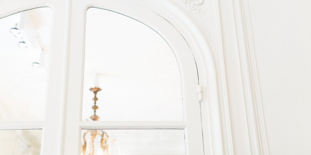 An image showing a partial view through a window into a London flat.