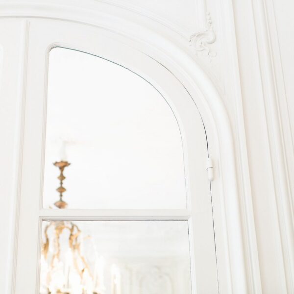 An image showing a partial view through a window into a London flat.