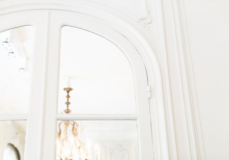An image showing a partial view through a window into a London flat.