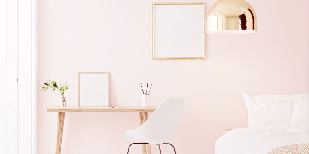 Image of a pretty bedroom with simple styling, creating a modern, feminine aesthetic by Spark & Bright. Pretty room makeovers for short-stay rentals.
