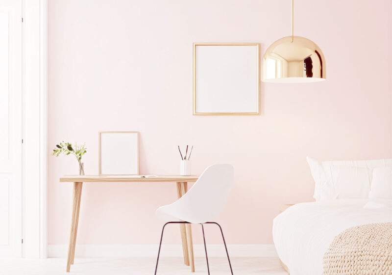 Image of a pretty bedroom with simple styling, creating a modern, feminine aesthetic by Spark & Bright. Pretty room makeovers for short-stay rentals.
